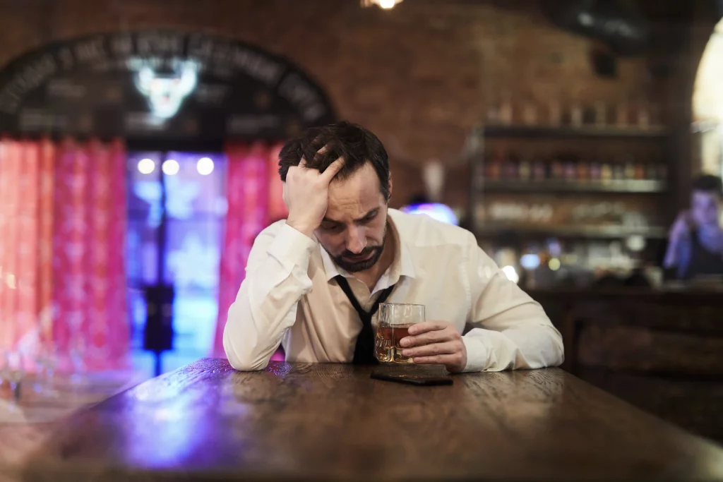 Depressed man in bar